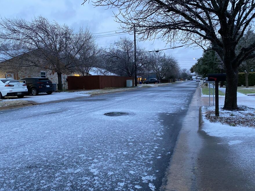 A view down an Austin street that is covered in slick ice.
